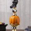 17 Inch Resin Black White Orange And Gold Finial With Flying Witch 1 17 Inch Resin Black White Orange And Gold Finial With Flying Witch -Halloween Costumes resin black white orange and gold finial with witch